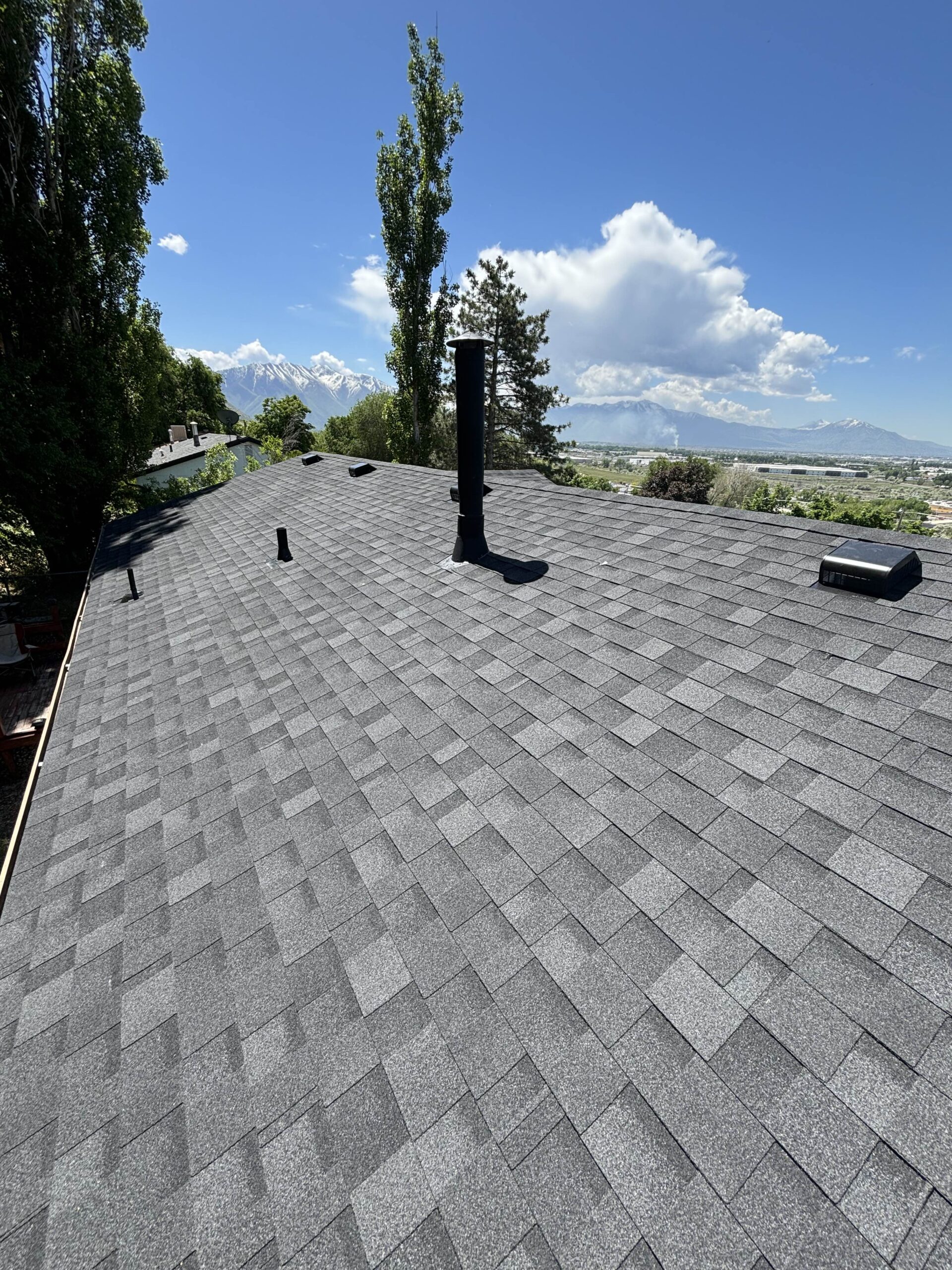 Finished asphalt shingle roof with Utah mountain views
